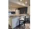 Eat-in kitchen features bar seating and stainless steel sink at 1920 W Lindner W Ave # 108, Mesa, AZ 85202