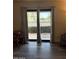 Light-filled living room with sliding glass doors and view of a grassy area at 1920 W Lindner W Ave # 108, Mesa, AZ 85202
