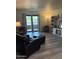 Inviting living room featuring wood-look floors, neutral paint, and abundant natural light at 1920 W Lindner W Ave # 108, Mesa, AZ 85202