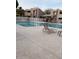 Community pool with lounge chairs and a pergola at 1920 W Lindner W Ave # 108, Mesa, AZ 85202