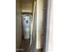 Compact utility closet featuring an efficient water heater and some built-in shelving at 1920 W Lindner W Ave # 108, Mesa, AZ 85202
