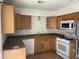 Kitchen with oak cabinets, gas range and dishwasher at 2119 W Danbury Rd, Phoenix, AZ 85023