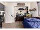 Bright bedroom with double bed, dresser, and spacious closet at 25239 S Glenburn Dr, Sun Lakes, AZ 85248