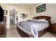 Comfortable main bedroom with a view and ensuite bathroom access at 25239 S Glenburn Dr, Sun Lakes, AZ 85248