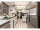Updated kitchen boasts stainless steel refrigerator and ample counter space at 25239 S Glenburn Dr, Sun Lakes, AZ 85248