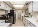 Modern kitchen with stainless steel appliances and tile flooring at 25239 S Glenburn Dr, Sun Lakes, AZ 85248