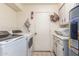 Laundry room with washer, dryer, and storage cabinets at 25239 S Glenburn Dr, Sun Lakes, AZ 85248