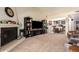 Living area featuring a fireplace and built-in shelving at 25239 S Glenburn Dr, Sun Lakes, AZ 85248
