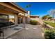 Private patio with pet bed and seating area at 25239 S Glenburn Dr, Sun Lakes, AZ 85248