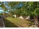 Landscaped backyard with grassy area and mature trees at 4213 E Edgemont Ave, Phoenix, AZ 85008