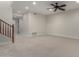 Finished basement with neutral carpeting and ceiling fan at 4213 E Edgemont Ave, Phoenix, AZ 85008