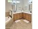 Double vanity bathroom with soaking tub at 4213 E Edgemont Ave, Phoenix, AZ 85008