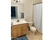 Bathroom with shower/tub, vanity, and tile flooring at 4213 E Edgemont Ave, Phoenix, AZ 85008