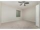 Well-lit bedroom featuring a ceiling fan and closet at 4213 E Edgemont Ave, Phoenix, AZ 85008