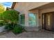 Front entrance of a home with stonework, iron door, and lush landscaping at 4213 E Edgemont Ave, Phoenix, AZ 85008