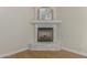 Gas fireplace with marble surround and wood mantel in a corner at 4213 E Edgemont Ave, Phoenix, AZ 85008