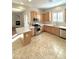 Kitchen featuring light wood cabinets, stainless steel appliances, and an island at 4213 E Edgemont Ave, Phoenix, AZ 85008