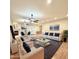 Bright and airy living room featuring a fireplace, modern furnishings, and a view to the kitchen at 4213 E Edgemont Ave, Phoenix, AZ 85008
