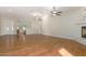 Bright living room with hardwood floors, high ceilings, and a view of the kitchen at 4213 E Edgemont Ave, Phoenix, AZ 85008