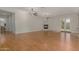 Spacious living room with hardwood floors, two ceiling fans, and fireplace at 4213 E Edgemont Ave, Phoenix, AZ 85008