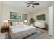 Serene main bedroom with a king-size bed, stylish decor, and ample natural light at 4213 E Edgemont Ave, Phoenix, AZ 85008