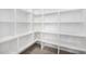 Bright white pantry with ample shelving at 4214 E Marion Way, Phoenix, AZ 85018