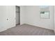 Bright bedroom featuring carpet and a closet at 4235 E Brook Lynn Pl, San Tan Valley, AZ 85143