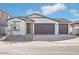 New construction home with a two-car garage and neutral exterior at 4235 E Brook Lynn Pl, San Tan Valley, AZ 85143