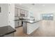 Modern kitchen with gray cabinets, quartz countertops and island at 4235 E Brook Lynn Pl, San Tan Valley, AZ 85143