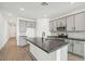 Modern kitchen with gray cabinets and a large island at 4235 E Brook Lynn Pl, San Tan Valley, AZ 85143