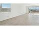 Bright living room with tile floors and sliding glass doors leading to backyard at 4235 E Brook Lynn Pl, San Tan Valley, AZ 85143