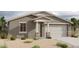 Single-story home with 2-car garage and desert landscaping at 5630 W Olney Ave, Laveen, AZ 85339