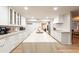 Modern kitchen featuring white cabinetry, a large island, and high-end appliances at 6127 E Mescal St, Scottsdale, AZ 85254