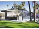 Outdoor entertainment area with a pool, misting system, and built-in bar at 6127 E Mescal St, Scottsdale, AZ 85254