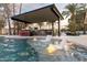 Modern pool with swim-up bar and outdoor kitchen at 6127 E Mescal St, Scottsdale, AZ 85254