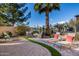 Relaxing backyard with fire pit and lounge chairs at 6202 E Mckellips Rd # 117, Mesa, AZ 85215