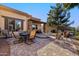 Spacious backyard with patio, seating, and lawn at 6202 E Mckellips Rd # 117, Mesa, AZ 85215