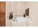 Relaxing bathroom with corner bathtub and decorative vases at 6202 E Mckellips Rd # 117, Mesa, AZ 85215