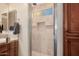 Walk-in shower with tiled walls and built-in shelves at 6202 E Mckellips Rd # 117, Mesa, AZ 85215