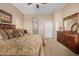 Large bedroom with king-size bed, dresser, and ceiling fan at 6202 E Mckellips Rd # 117, Mesa, AZ 85215