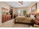 Bright bedroom with king-size bed, dresser and large window at 6202 E Mckellips Rd # 117, Mesa, AZ 85215