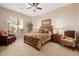 Spacious bedroom with wood furniture and access to backyard at 6202 E Mckellips Rd # 117, Mesa, AZ 85215