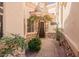 Inviting front entry with stone accents and lush landscaping at 6202 E Mckellips Rd # 117, Mesa, AZ 85215