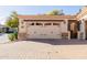 Two-car garage with paver driveway and stone accents at 6202 E Mckellips Rd # 117, Mesa, AZ 85215