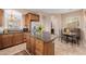 Kitchen with island, granite counters, and breakfast nook at 6202 E Mckellips Rd # 117, Mesa, AZ 85215