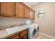 Laundry room with washer, dryer, and ample cabinet space at 6202 E Mckellips Rd # 117, Mesa, AZ 85215