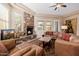 Spacious living room with a stone fireplace and comfortable seating at 6202 E Mckellips Rd # 117, Mesa, AZ 85215