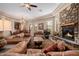 Open concept living room with a fireplace and dining area at 6202 E Mckellips Rd # 117, Mesa, AZ 85215