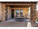 Covered patio with seating area and built-in grill at 6202 E Mckellips Rd # 117, Mesa, AZ 85215