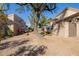 Pathway through a side yard with desert landscaping at 6202 E Mckellips Rd # 117, Mesa, AZ 85215